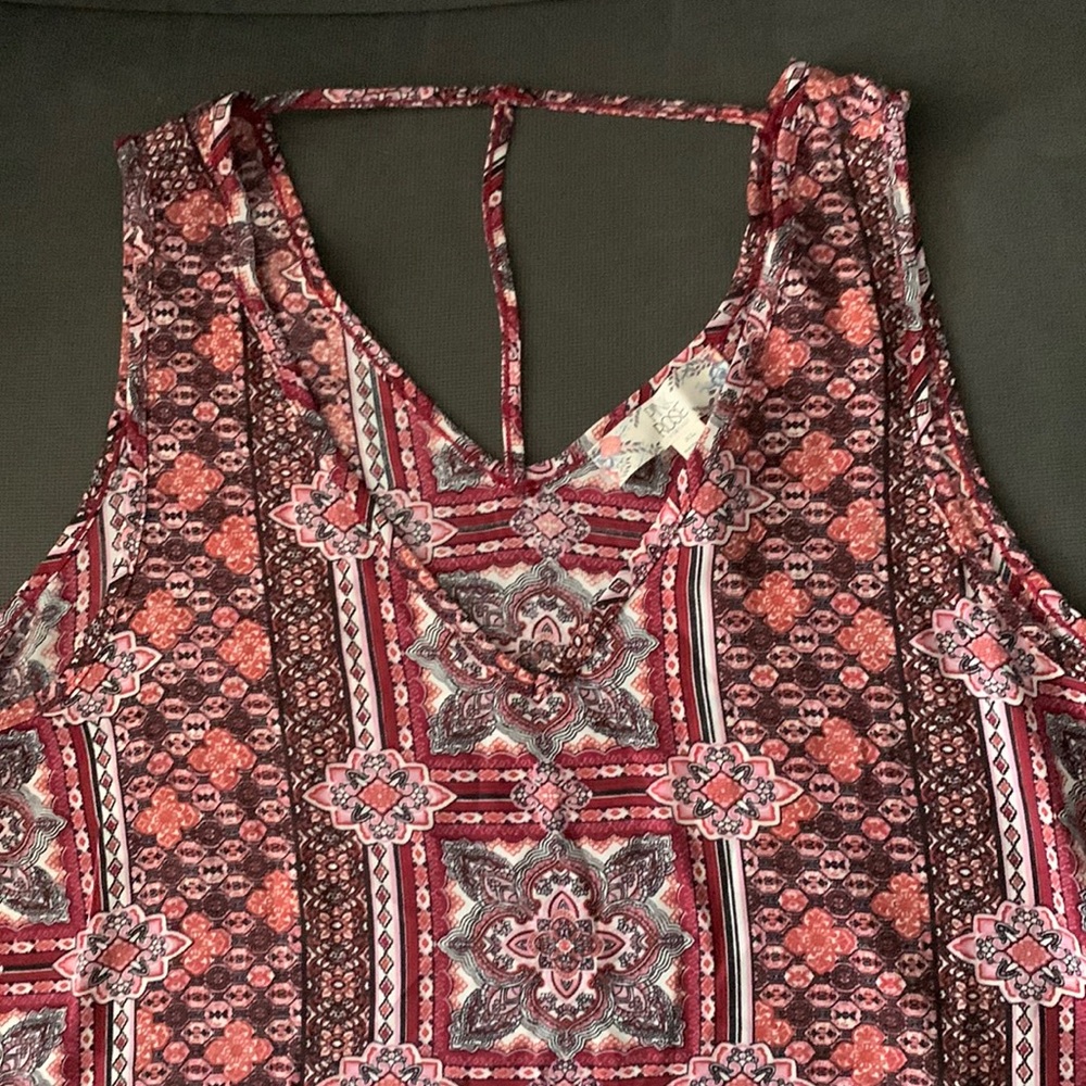 Beautiful woman’s dress or casual tank top with thin T back v neck design.